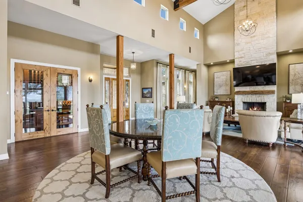 a dining room with furniture window and wooden floor