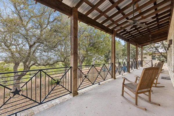 a view of two chairs in the balcony