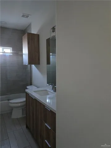 a bathroom with a sink and a toilet