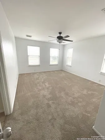 a spacious bathroom with a double vanity sink and a mirror
