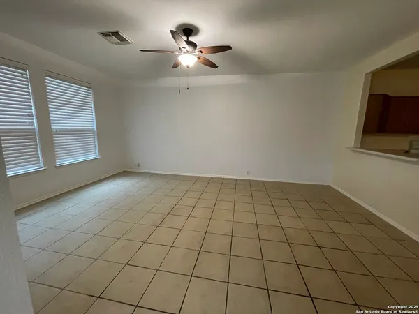 a view of an empty room and a window