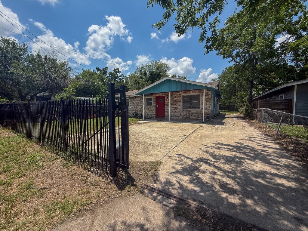 1412 Vargas Road, Unit A Austin, TX 78741 - Photo 11 of 32 a view of a house with a wooden fence