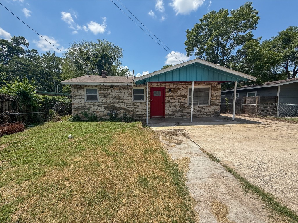 1412 Vargas Road, Unit A Austin, TX 78741 - Photo 12 of 32 a front view of a house with a garden