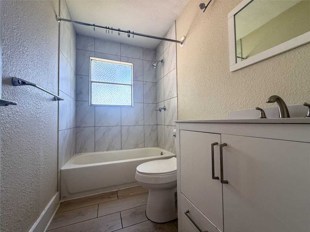 1412 Vargas Road, Unit A Austin, TX 78741 - Photo 26 of 32 a bathroom with a toilet and a shower