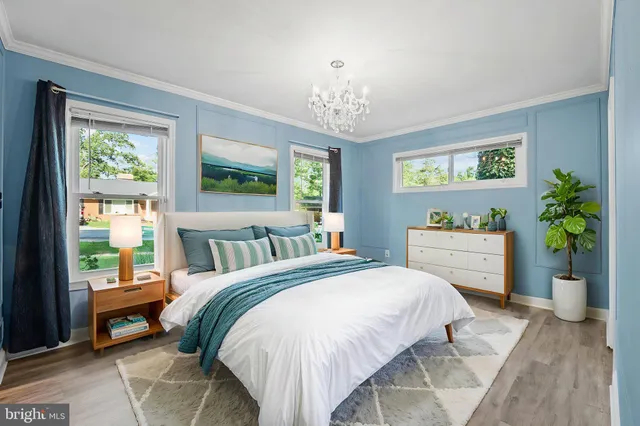 a spacious bedroom with a bed and a window