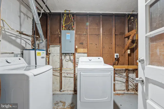 a utility room with dryer and washer