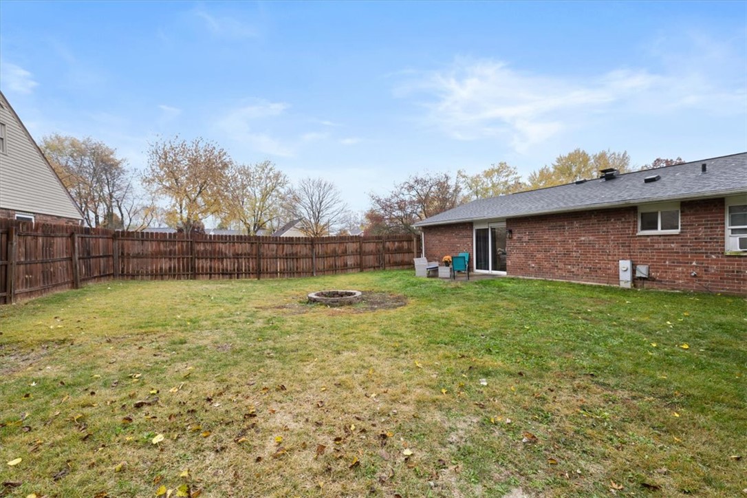 1482 Lee Road Troy, OH 45373 - Photo 25 of 30 This spacious backyard with a patio and privacy fence offers a serene outdoor retreat.