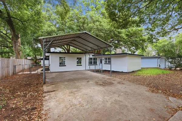 a house with trees in the background