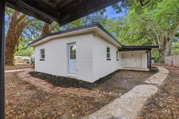 a view of a house with a yard and garage