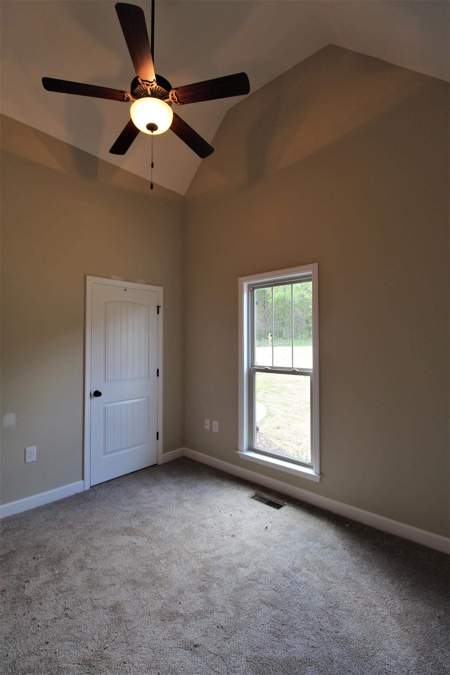 2521 Turner Road Watertown, TN 37184 - Photo 16 of 23 an empty room with a window and a fan