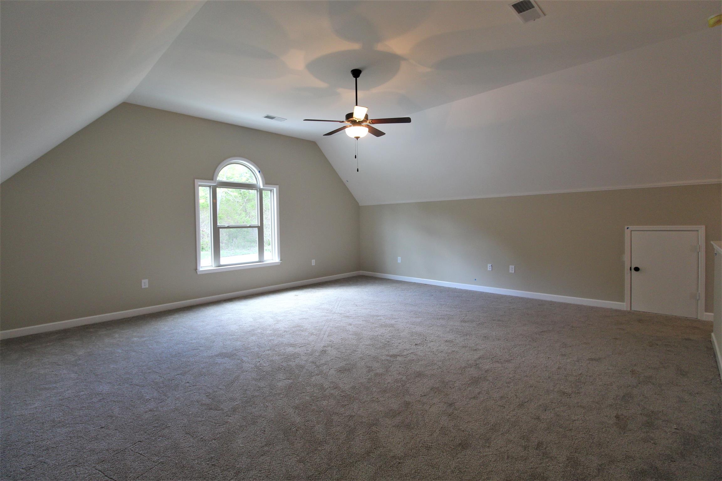 2521 Turner Road Watertown, TN 37184 - Photo 23 of 23 an empty room with windows and chandelier fan