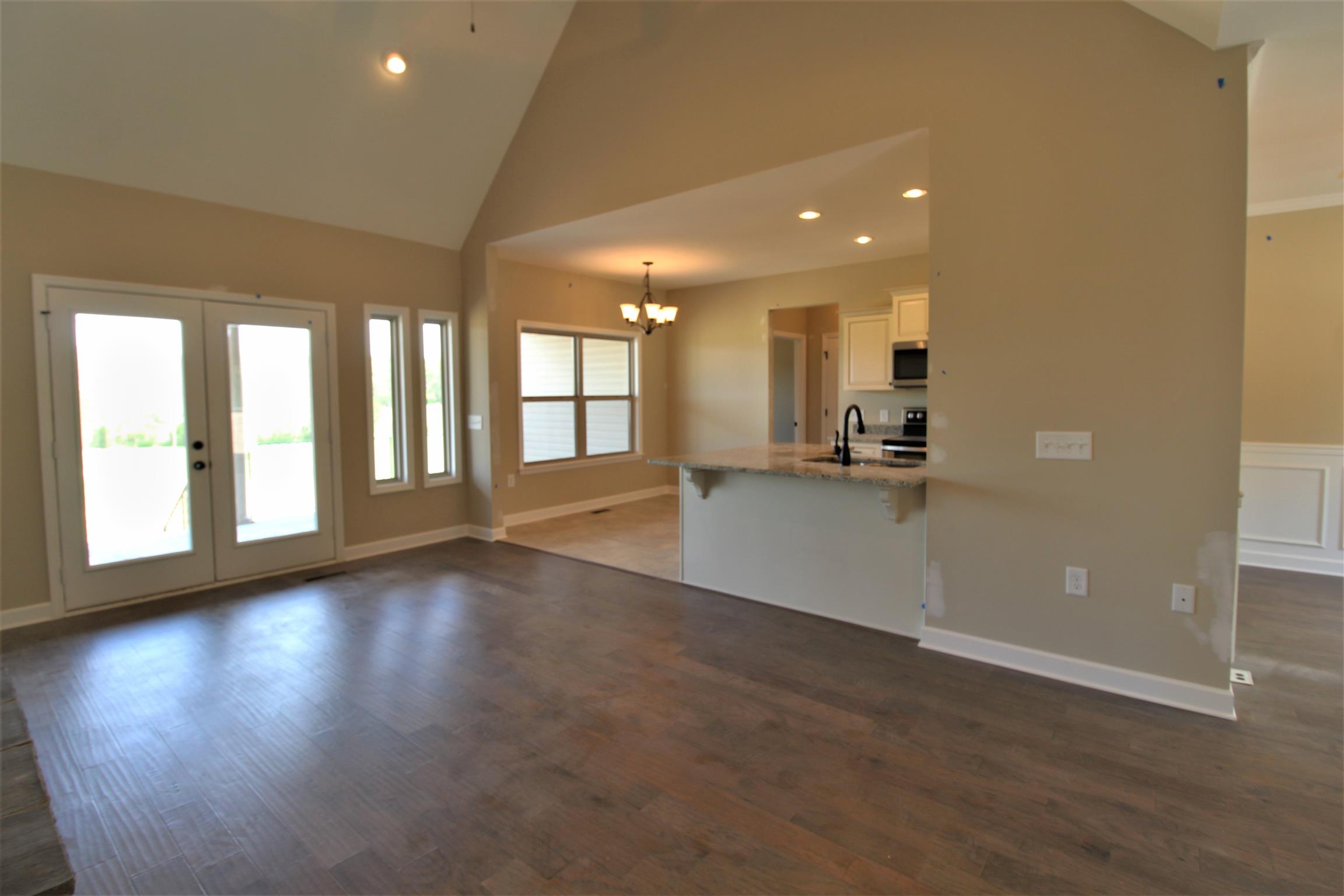 2521 Turner Road Watertown, TN 37184 - Photo 5 of 23 an empty room with wooden floor and windows