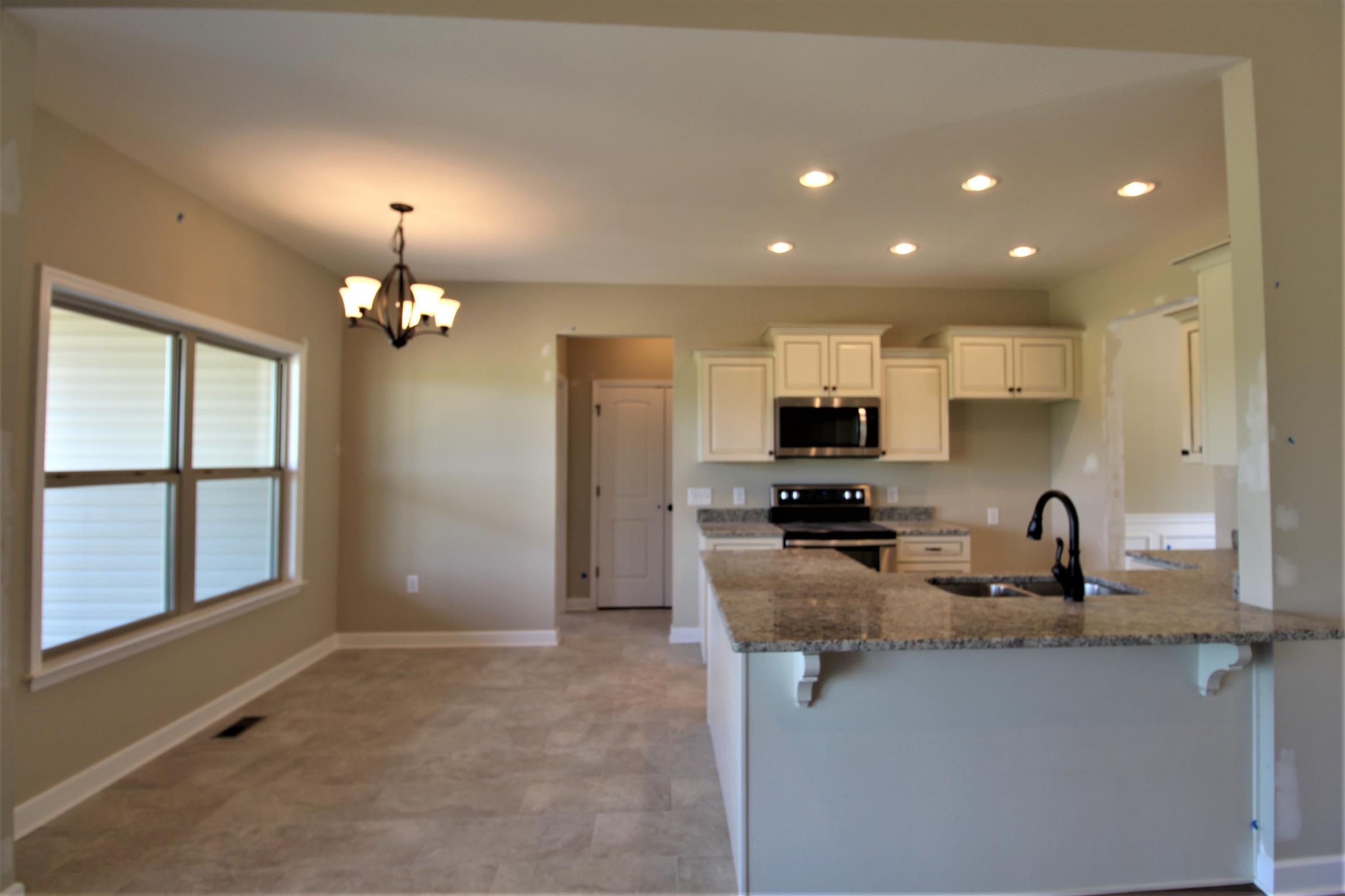 2521 Turner Road Watertown, TN 37184 - Photo 7 of 23 a kitchen with sink a refrigerator and cabinets