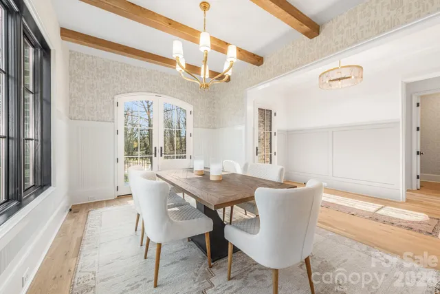 a view of a dining room with furniture and window