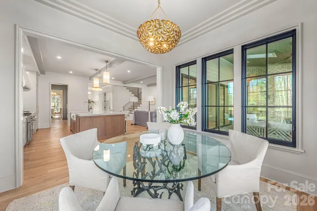 a dining room with furniture a livingroom and chandelier