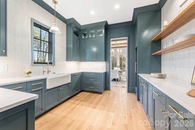 a bathroom with a sink double vanity granite tub shower and a mirror
