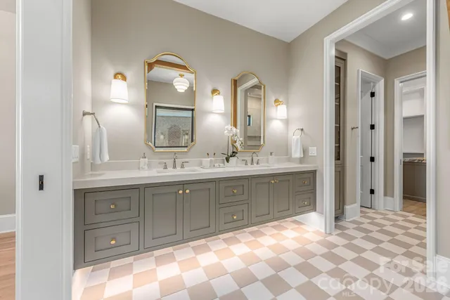 a spacious bathroom with a double vanity sink mirror and a