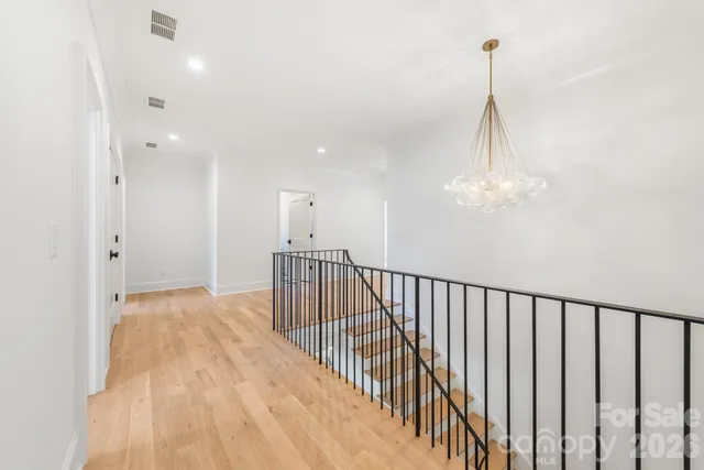 a view of a hallway with a chandelier