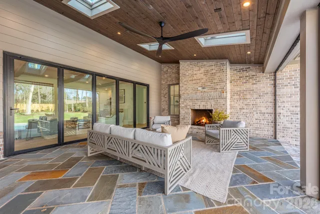 a living room with furniture windows and a fireplace