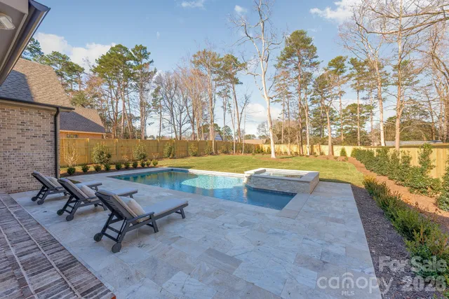 a view of a swimming pool with an outdoor space