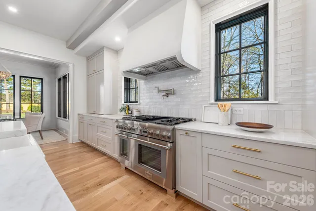 a kitchen with a stove oven and sink