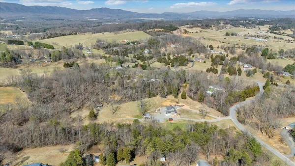 an aerial view of residential house and outdoor space