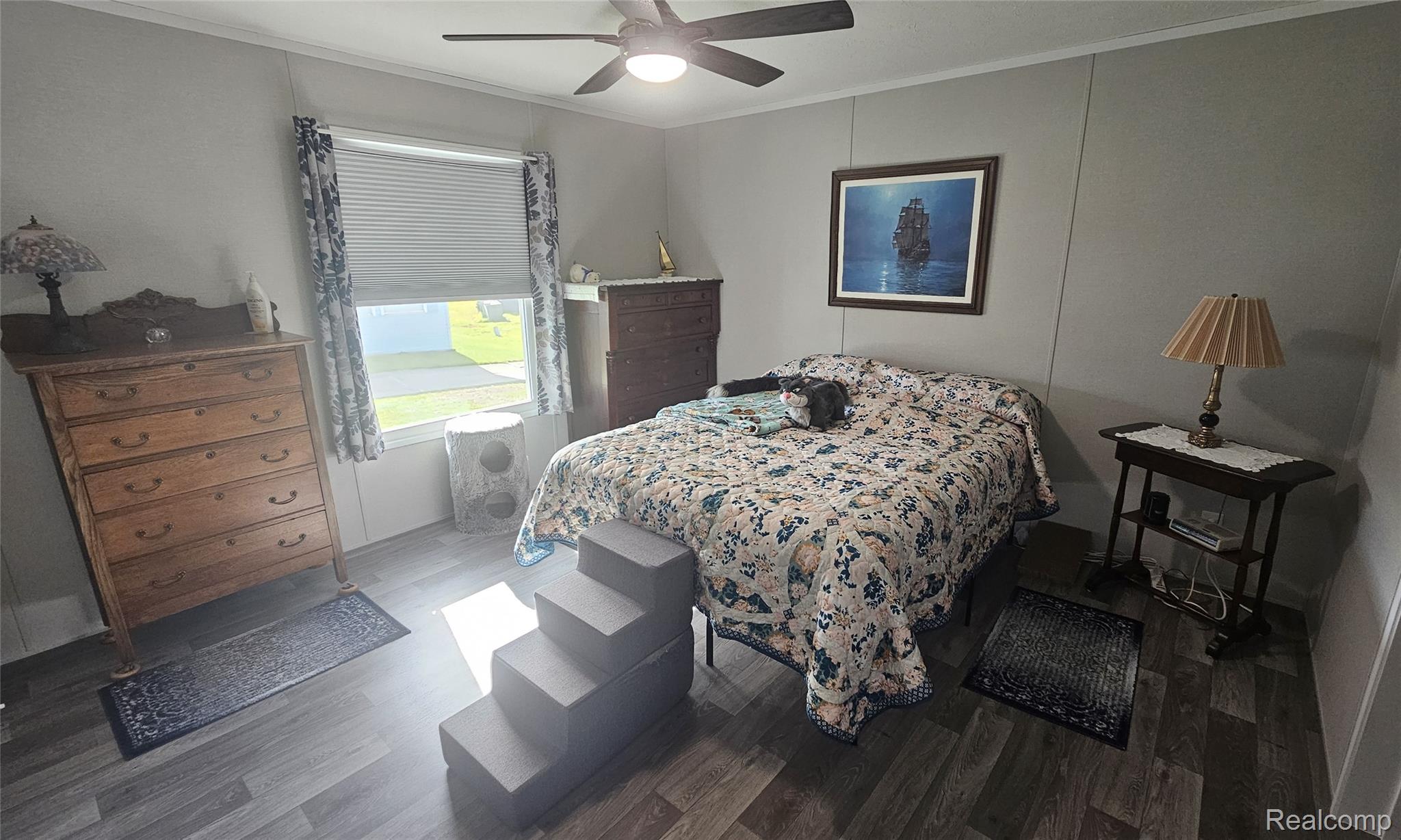 29 Hickory Ridge Davison, MI 48423 - Photo 11 of 26 Bedroom with ornamental molding, wood finished floors, and a ceiling fan