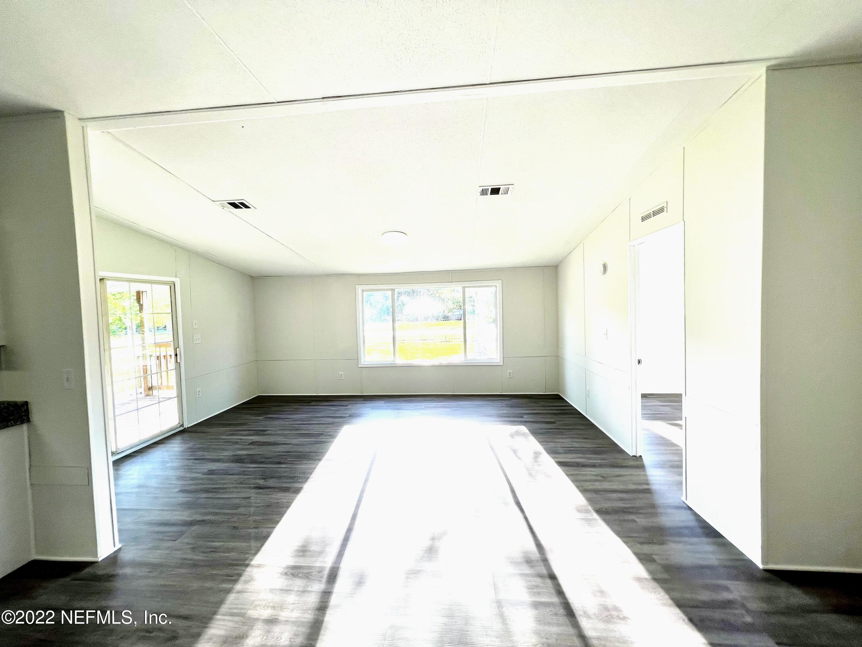 54176 Armstrong Road Callahan, FL 32011 - Photo 13 of 30 a view of a room with a wooden floor