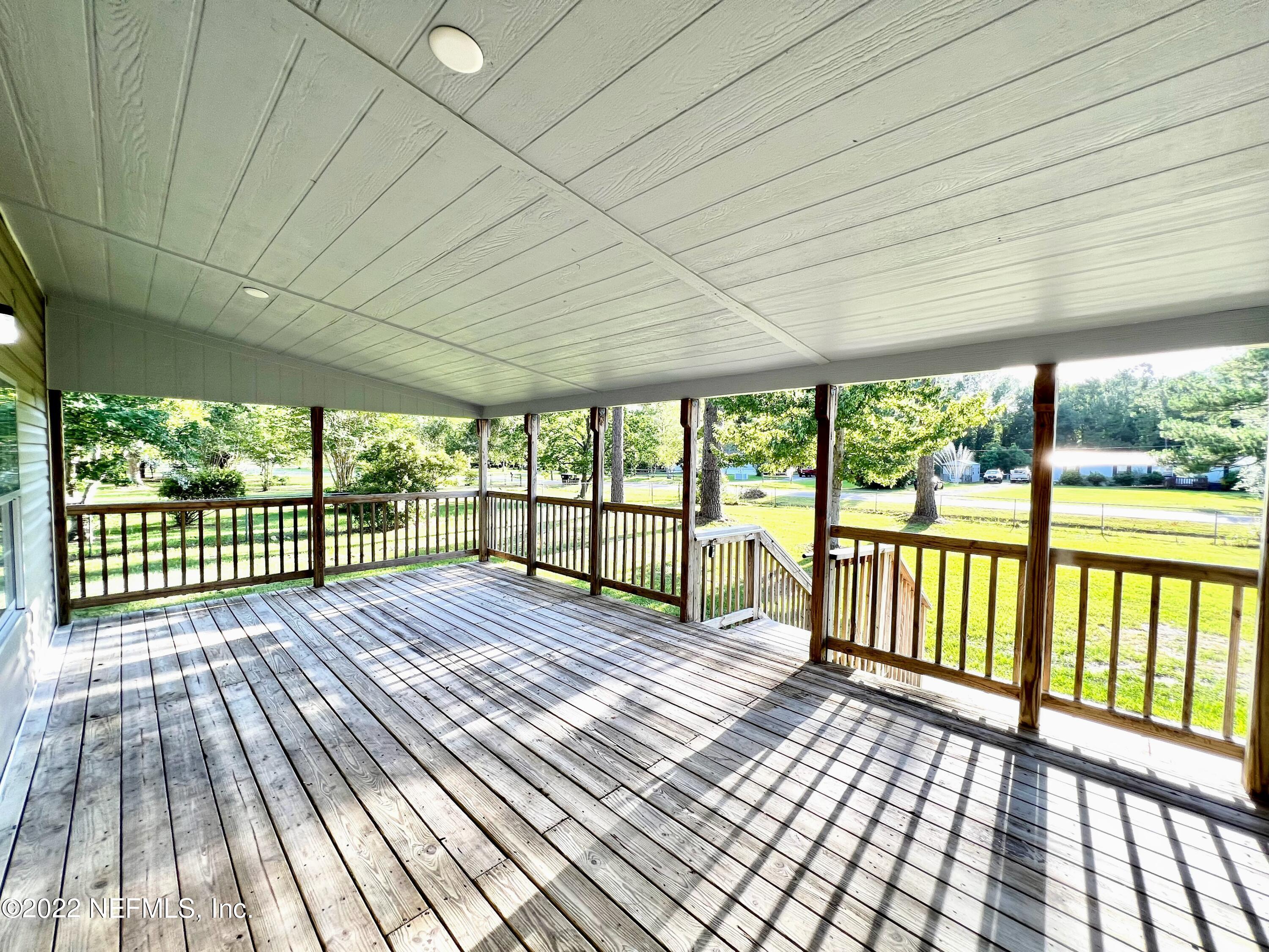 54176 Armstrong Road Callahan, FL 32011 - Photo 3 of 30 a view of a wooden deck