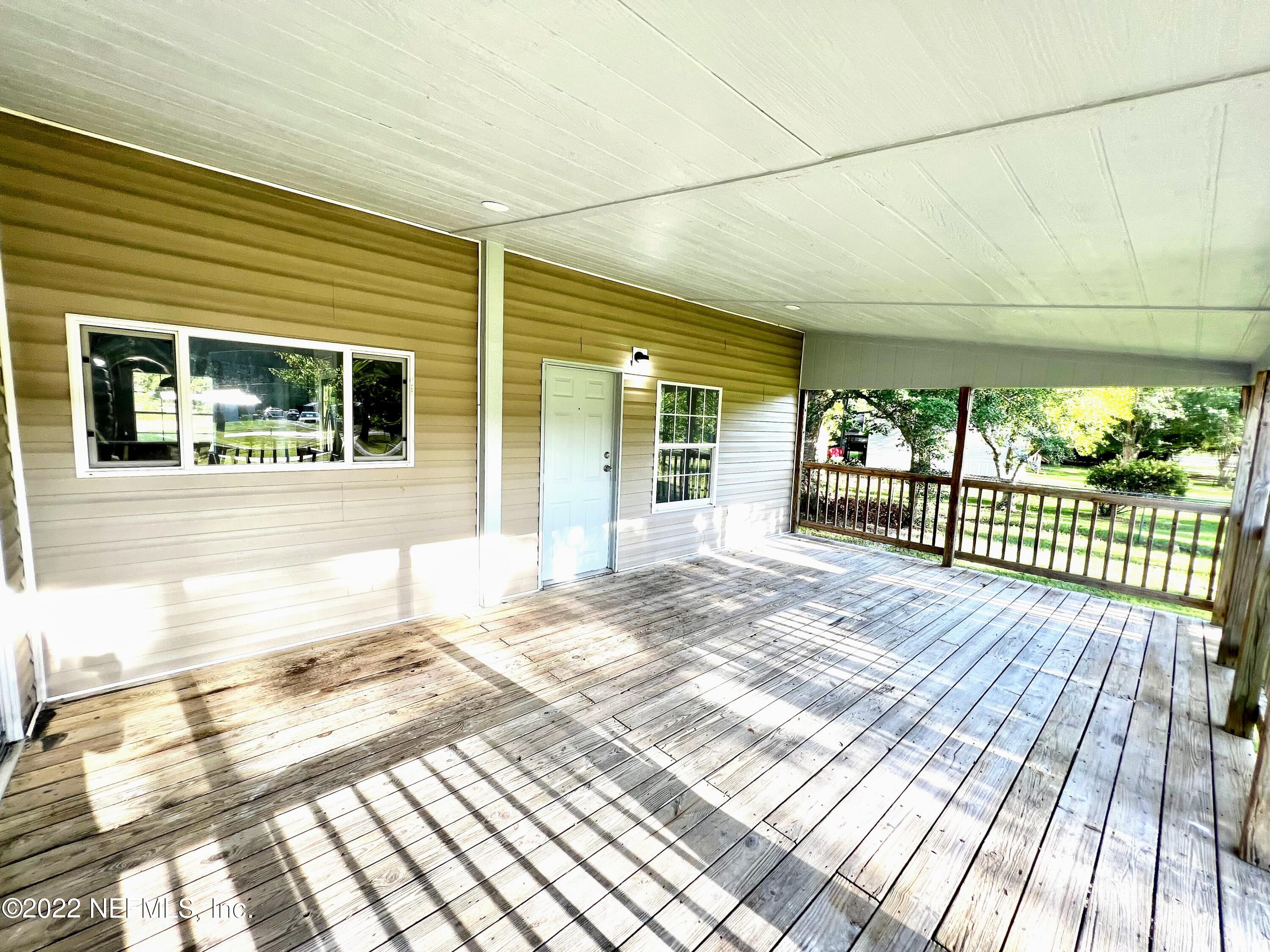 54176 Armstrong Road Callahan, FL 32011 - Photo 4 of 30 a view of a balcony with wooden floor