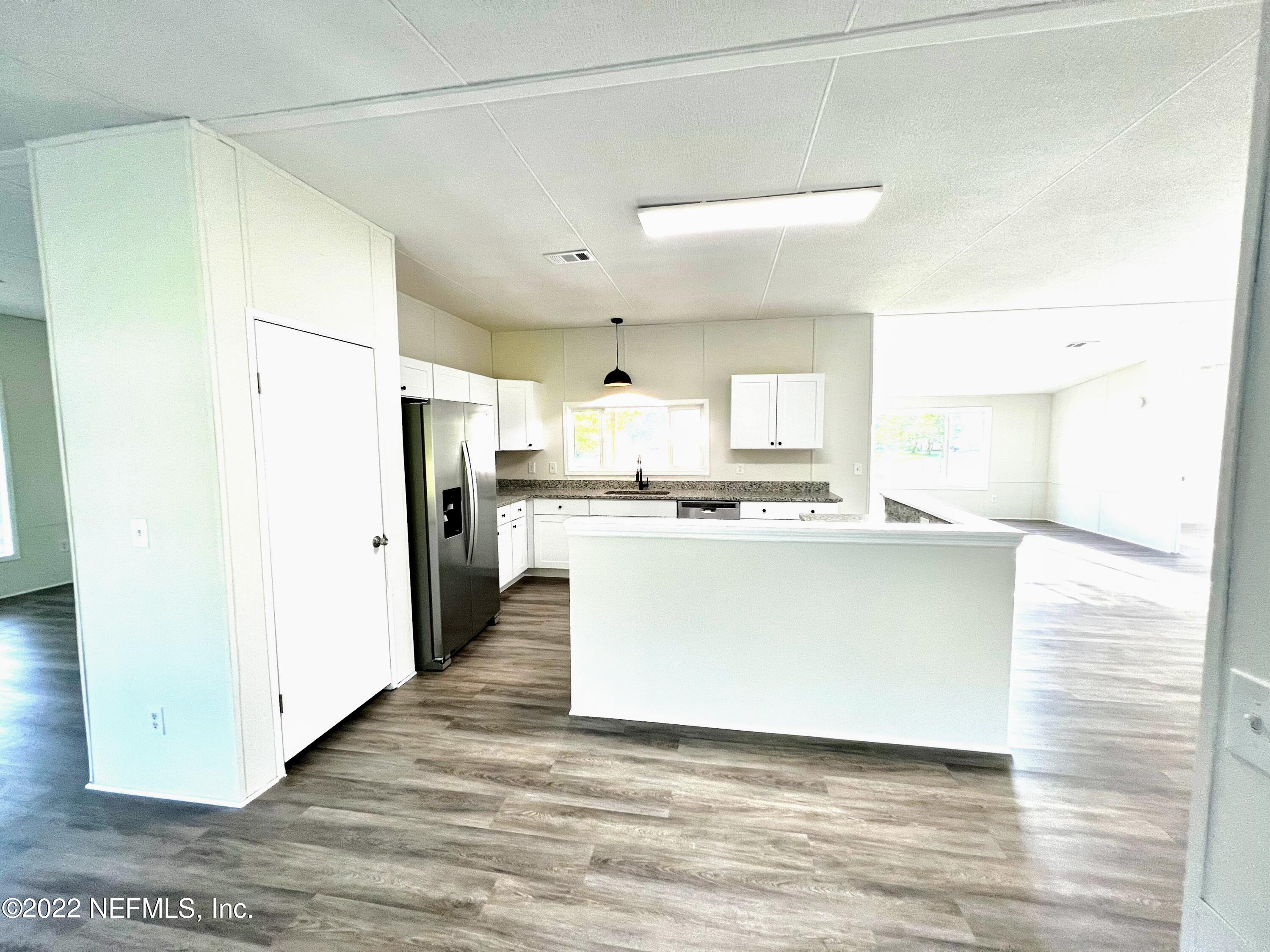 54176 Armstrong Road Callahan, FL 32011 - Photo 9 of 30 a view of kitchen with white cabinets