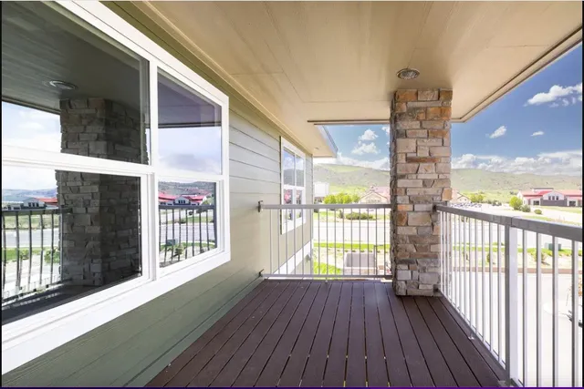 a view of balcony with wooden floor