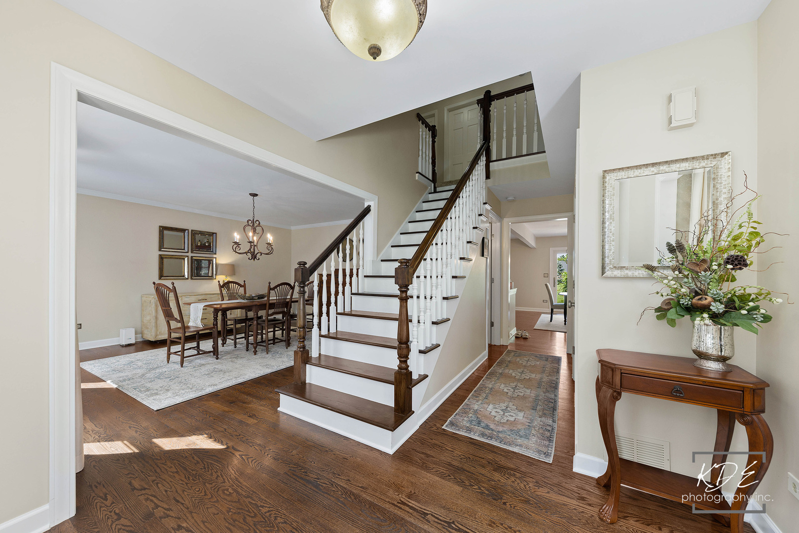 1403 Carlyle Road Naperville, IL 60564 - Photo 2 of 31 a view of entryway dining room and hall with wooden floor