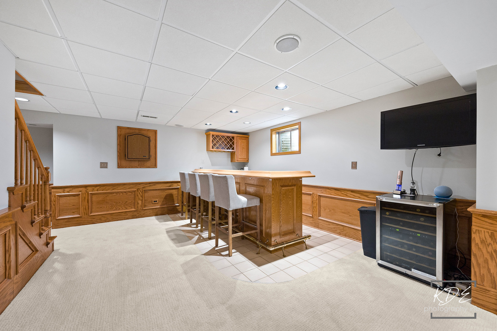 1403 Carlyle Road Naperville, IL 60564 - Photo 21 of 31 a living room with furniture a flat screen tv and kitchen view