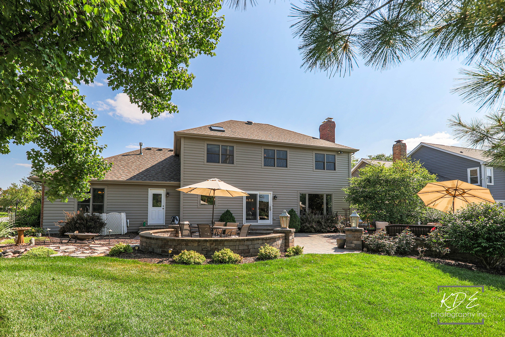 1403 Carlyle Road Naperville, IL 60564 - Photo 26 of 31 a front view of a house with a garden and plants