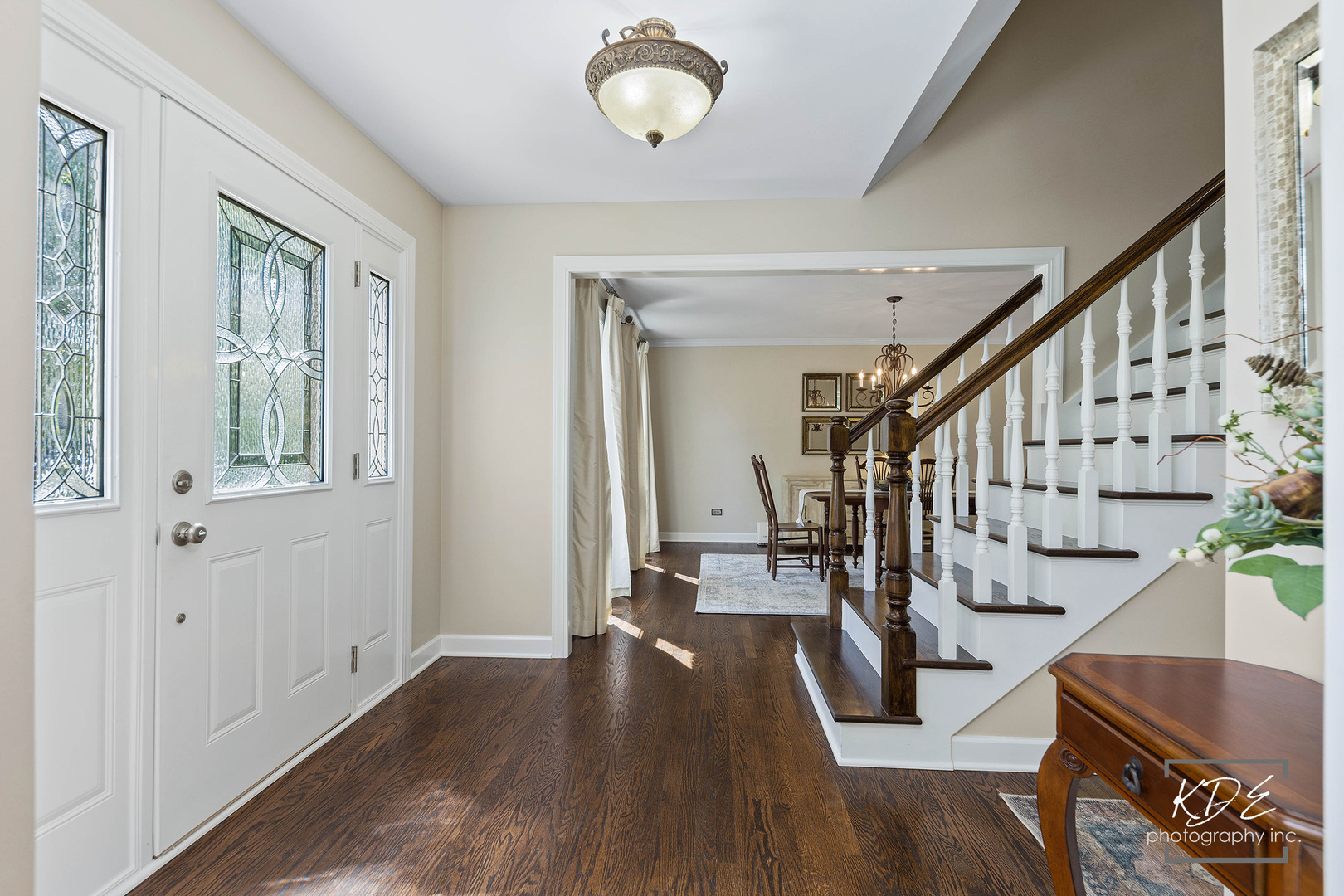 1403 Carlyle Road Naperville, IL 60564 - Photo 3 of 31 a view of entryway with wooden floor and stairs
