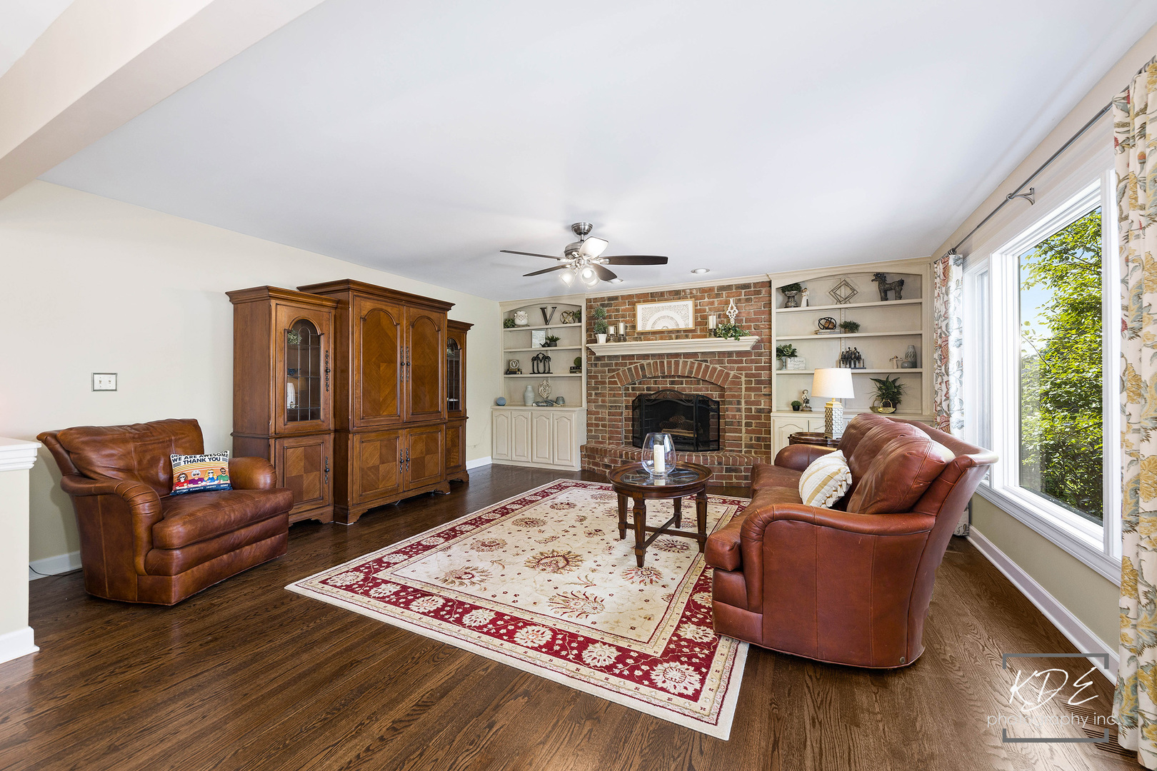1403 Carlyle Road Naperville, IL 60564 - Photo 9 of 31 a living room with furniture and a fireplace