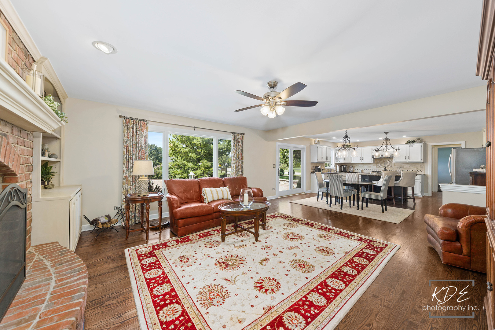 1403 Carlyle Road Naperville, IL 60564 - Photo 10 of 31 a living room with furniture a rug and a chandelier