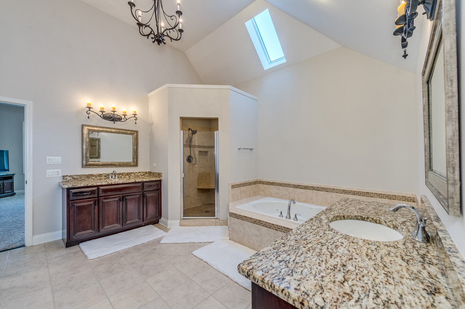 2918 Hapner Way Batavia, IL 60510 - Photo 24 of 43 a spacious bathroom with a granite countertop sink and a bathtub