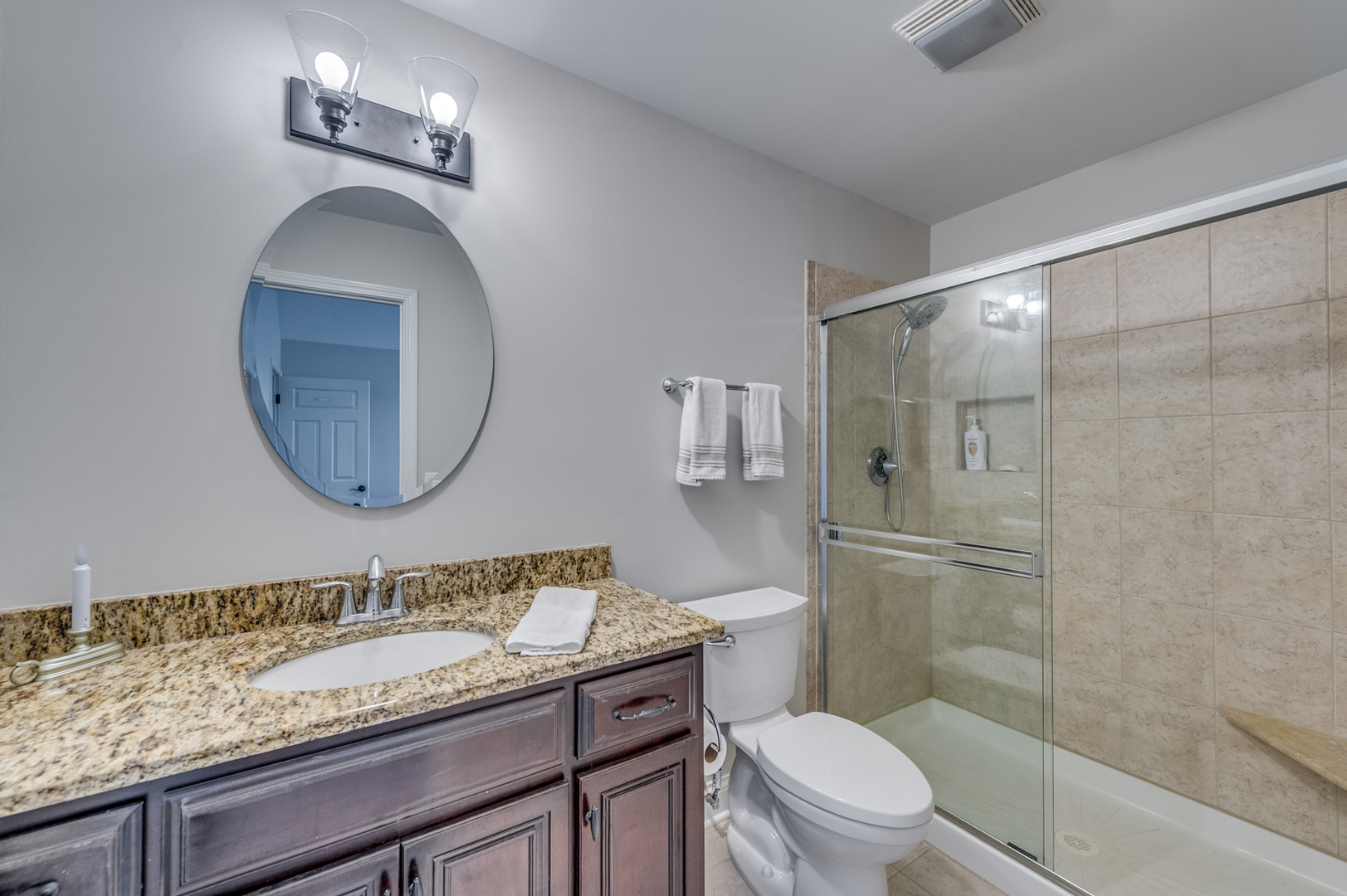 2918 Hapner Way Batavia, IL 60510 - Photo 27 of 43 a bathroom with a granite countertop toilet a sink and a mirror