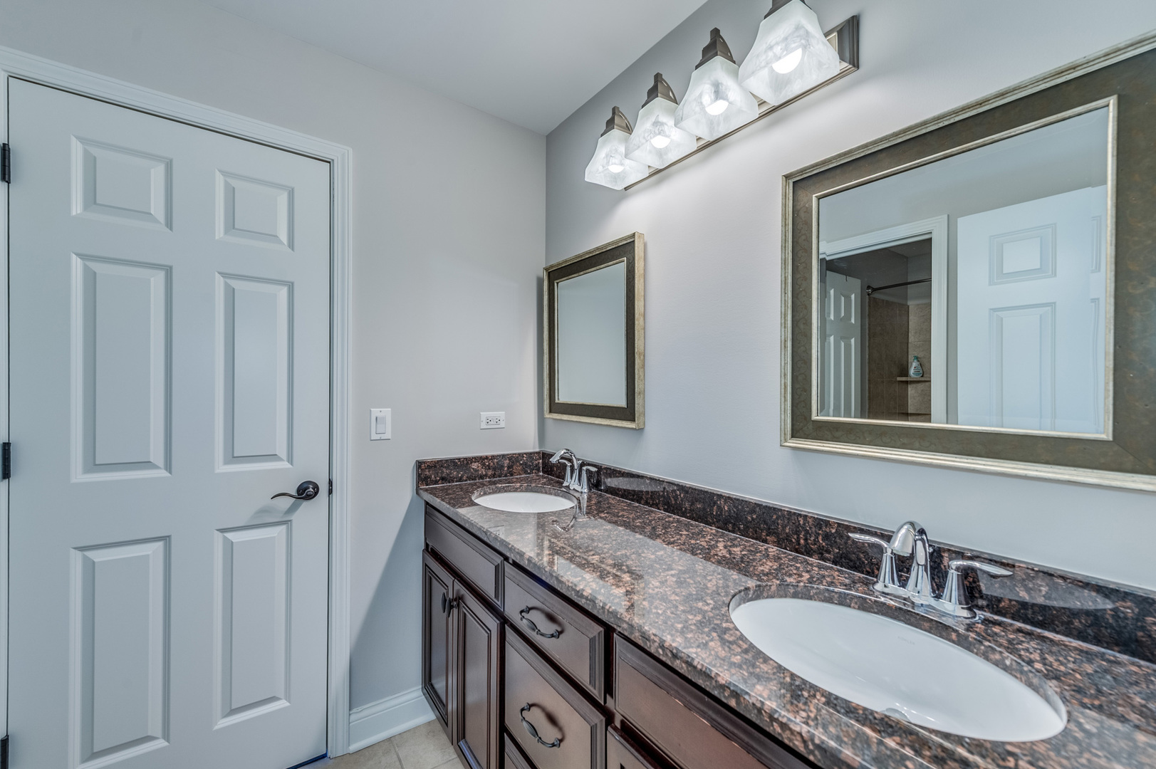2918 Hapner Way Batavia, IL 60510 - Photo 29 of 43 a bathroom with a granite countertop sink and a mirror