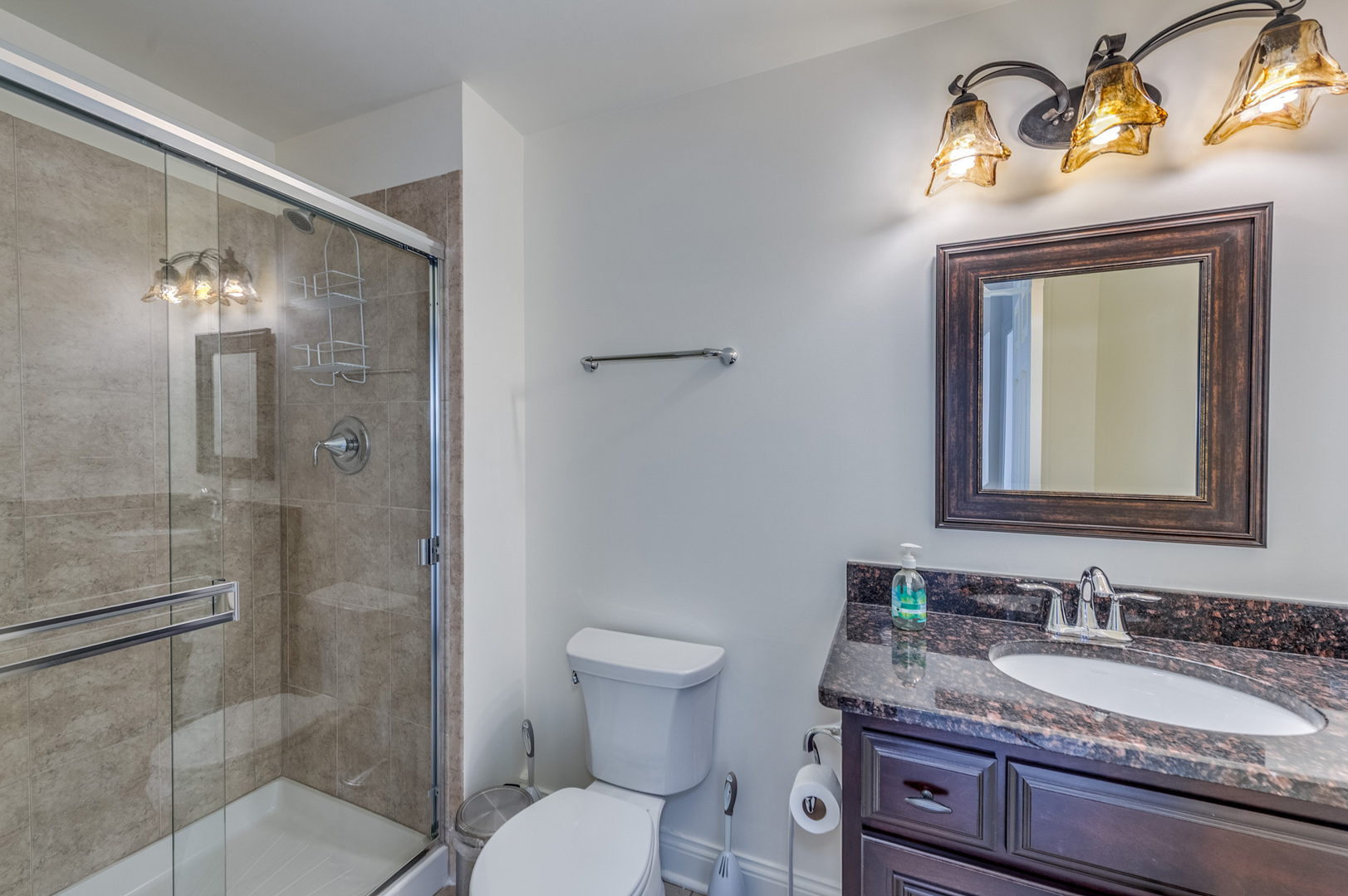 2918 Hapner Way Batavia, IL 60510 - Photo 35 of 43 a bathroom with a granite countertop toilet a sink and a mirror