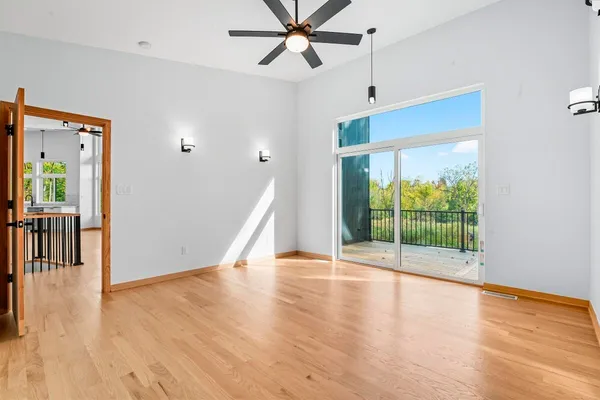 a view of an entryway with wooden floor