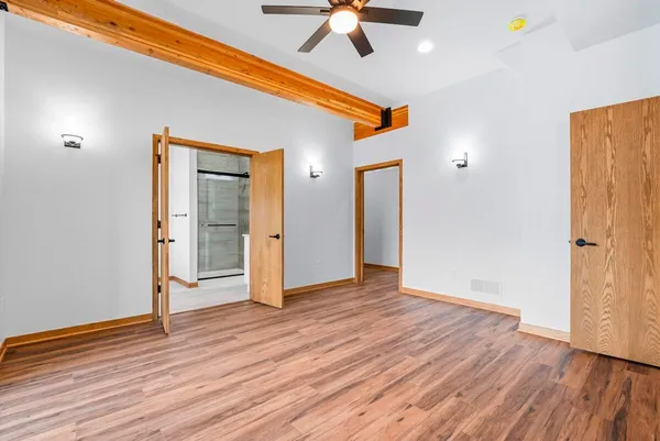 a bathroom with a shower and a sink