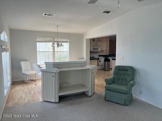 5361 Bison Street, Unit P19 Micco, FL 32976 - Photo 21 of 27 a living room with furniture and a window