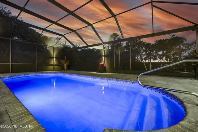 a spacious bathroom with a double vanity sink mirror and bathtub