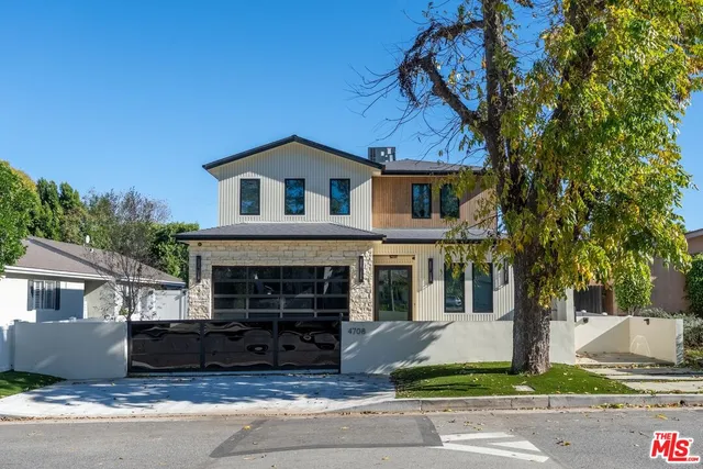a front view of a house with garage