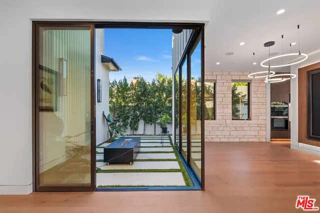 a kitchen with stainless steel appliances granite countertop a sink and a stove