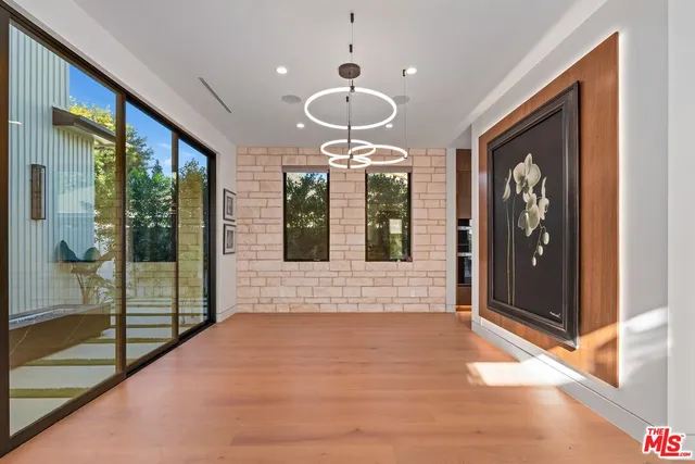 a kitchen with stainless steel appliances granite countertop a sink and a stove