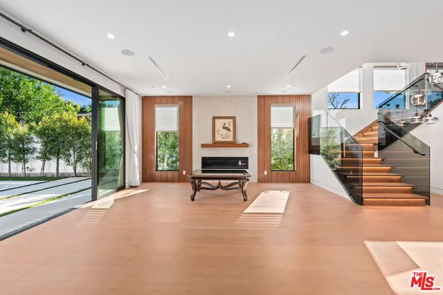 a bathroom with a shower a toilet and a window